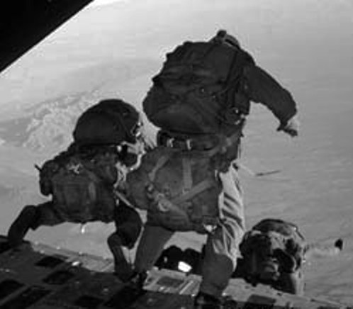 US Army paratroopers jump from a C-130 flying 25,000 feet over the Arizona desert