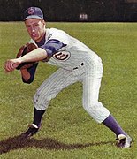 Baseball card with a red background and the words "Cracker Jack".