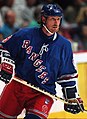 Image 13 Wayne Gretzky Photo credit: Håkan Dahlström Ice hockey player Wayne Gretzky, as a member of the New York Rangers of the National Hockey League (NHL) in 1997. Gretzky, nicknamed "The Great One", is widely considered the best hockey player of all time. Upon his retirement in 1999, he held forty regular-season records, fifteen playoff records, and six All-Star records. He is the only NHL player to total over 200 points in one season—a feat he accomplished four times. In addition, he tallied over 100 points in 15 NHL seasons, 13 of them consecutively. He is the only player to have his number (99) officially retired by the NHL for all teams. More selected pictures