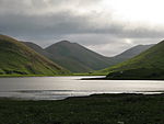 Hilly scenery with a river, low vegetation