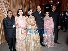 The Ambani and Piramal at the wedding reception of Isha Ambani-Anand Piramal (from left to right:-[[Mukesh Ambani]], [[Nita Ambani]], Isha Ambani, Anand Piramal, [[Swati Piramal]], Ajay Piramal