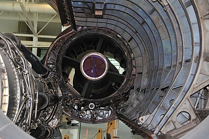 Fig.5 A rear view of the inlet where air enters the engine. Two features were added after flight testing highlighted the need, namely the mice and rear bypass. The 'mice' which are located in subsonic flow are visible as streamlined shapes. They were added to reduce the diffusion rate after rumbling was noted by pilots. Rear bypass doors were added to prevent unstarting the inlet during descents with low engine flow.[76] The ring of doors is at the extreme rear of the inlet as shown by their accompanying rear-turning scoop, extending from 7 o'clock to 5 o'clock, which directs the air through the nacelle to the ejector nozzle.[77] The door actuator<ref>https://ntrs.nasa.gov/citations/19740030201,