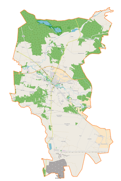 Mapa konturowa gminy Szczerców, blisko centrum na dole znajduje się punkt z opisem „Stanisławów Pierwszy”