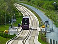 Image 66Kerb-guided track and adjacent multi-user path along a disused rail line, on the Leigh-Salford-Manchester Bus Rapid Transit (from Guided bus)