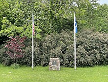 The Americans and Scottish flags alongside a memorial to John Paul Jones outside of his first home at Arbigland, Scotland.