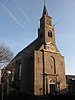 Nederlands Hervormde Kerk. Bakstenen zaalkerk met rondboogvensters