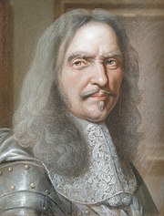 Portrait shows an old man with long grey hair, moustache and a mouche on the lower lip. He wears armour on his breast and arms.