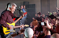 Members of the country music band Diamond Rio performing before an audience.