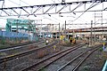 The view looking eastward from the Nambu Branch Line platform in April 2011. The tracks curving to the left are the Tokaido Freight Line, and the tracks to the right are freight tracks linking to the Tsurumi Line and yard.