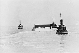 A Conundrum being towed across the English Channel laying out pipe behind it.