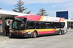 A red, white and yellow bus