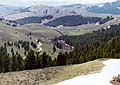 View from Lemhi Pass, eastward over the rolling, green, and partially wooded Bitterroot Mountains.