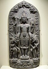 11th-century Vishnu sculpture the goddesses Lakshmi and Sarasvati. The edges show reliefs of Vishnu avatars Varaha, Narasimha, Balarama, Rama, and others. Also shown is Brahma. (Brooklyn Museum)[191]