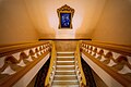 Staircase up to second floor with the hanging picture of emperor Khải Định and prince Vĩnh Thụy (future emperor Bảo Đại)