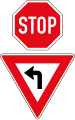 Stop. But drivers turning left must give way / yield