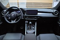 Dashboard of the car with front airbags, digital gauges, a satellite navigation touchscreen, automatic gearbox, electronic handbrake, button-operated heater and fan controls, a USB port, and an unlabeled rotary dial