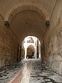 View of a courtyard through an arched alley in Antep