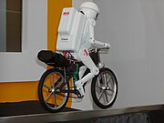 Murata Boy, a 50 cm (20") high bicycle-riding robot developed by the company since 1991[19][20][21]