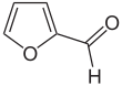 Skeleton formula of a ring of four carbons and one oxygen, with a carbon-oxygen attached to a carbon next to an oxygen