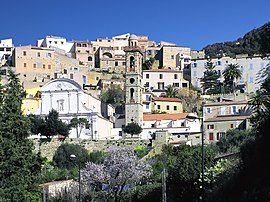 The buildings surrounding the bell tower in Lumio