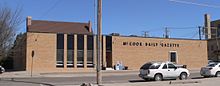 One-story brick building, taking up about a quarter-block