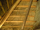 Inside view of a straw-thatched house.