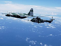 Air Force KC-130 refuels H-36 Caracal over Rio de Janeiro