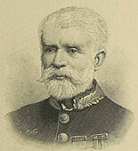 A man with a beard in military uniform.