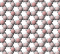 View of tetrahedral sheet of muscovite. The apical oxygen ions are tinted pink.