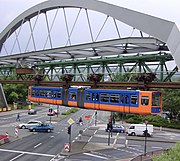 A 1977 train crossing an intersection