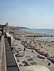 The beach crowded with people at lower tide