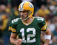 Rodgers in his uniform running on a field