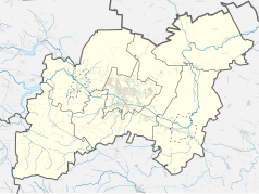 Mapa konturowa powiatu ostrowieckiego, blisko centrum na prawo u góry znajduje się punkt z opisem „Krzemionkowski region prehistorycznego górnictwa krzemienia pasiastego”