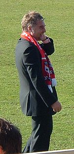 Jason McGill standing on a grass field