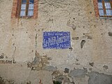 Ancienne publicité murale pour Le Petit Journal.