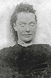 Mortuary photograph of Stride: a woman with angular features and a wide mouth