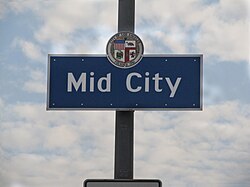 Mid City neighborhood sign located at the intersection of La Brea Avenue and the Santa Monica Freeway