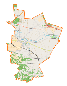 Mapa konturowa gminy Końskowola, blisko centrum na lewo znajduje się punkt z opisem „Kościół św. Anny”