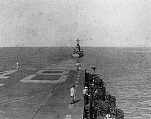 USS Oregon City (CA-122) tows USS Saipan (CVL-48) in the Caribbean Sea, in 1947