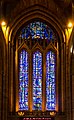 Liverpool Anglican Cathedral's| stained glass west window. The uppermost window is the Bedicite window. The pink neon sign by Tracey Emin - written in the artist’s handwriting - reads "I felt you and I knew you loved me“ and was installed for the 2008 Liverpool European Capital of Culture exhibitions. Liverpool, England. June 2012.