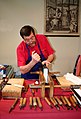 Image 36A traditional bookbinder at work (from Bookbinding)