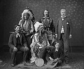 Black-and-white photo of six people in a room