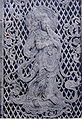 Relief of a Krishna previous Bodhisattva playing a flute on the temple's 8th century Octagonal Lantern.