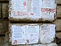 Detail of modern pasquinades glued to the base of Pasquino