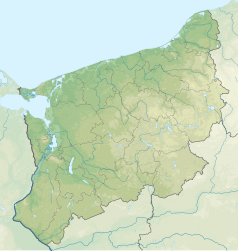 Mapa konturowa województwa zachodniopomorskiego, blisko centrum na lewo u góry znajduje się czarny trójkącik z opisem „Ilna”