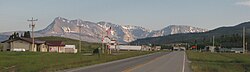 The mountains of Glacier National Park rising to the west over Babb