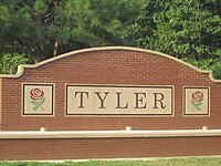 A roadside plaque reading "Tyler".