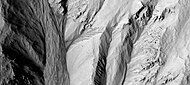 Gully alcoves as seen by HiRISE under HiWish program This image was named HiRISE Picture of the Day for June 25, 2024.