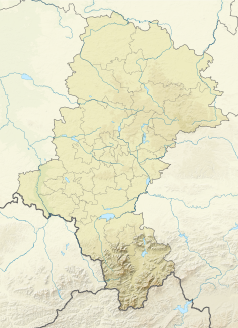 Mapa konturowa województwa śląskiego, na dole nieco na prawo znajduje się czarny trójkącik z opisem „Łazek”