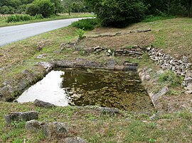 The abandoned washing pool, on the north side of the D15 road